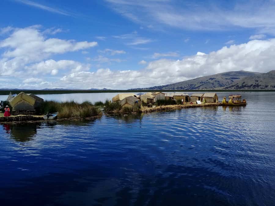 From Puno: Floating Islands of the Uros Half-Day Tour - Reed boat ride: the one extra fee that changes the experience