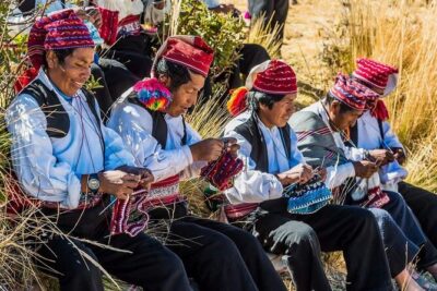 Full Day Lake Titicaca Tour to Uros and Taquile Islands - Uros floating islands: totora life, Aymara greetings, and a community demo