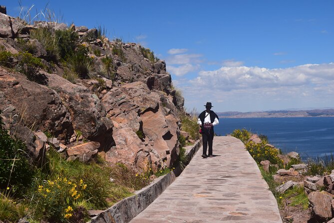 Full-Day Tour of Uros, Taquile and Sillustani from Puno - Sillustani chullpas: the 10-meter tower and the Lake Umayo setting
